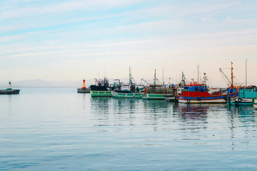 Fishing boats moored in a calm harbour